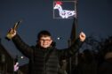 Lochlan Aitken, 10, with his trophy for winning the competition and his goose Christmas light. Image: Mhairi Edwards/DC Thomson