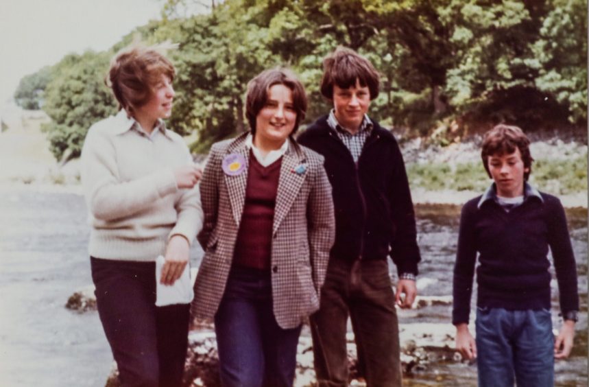 four youngsters pictured beside the river on a trip to Pitlochry Dam in 1979