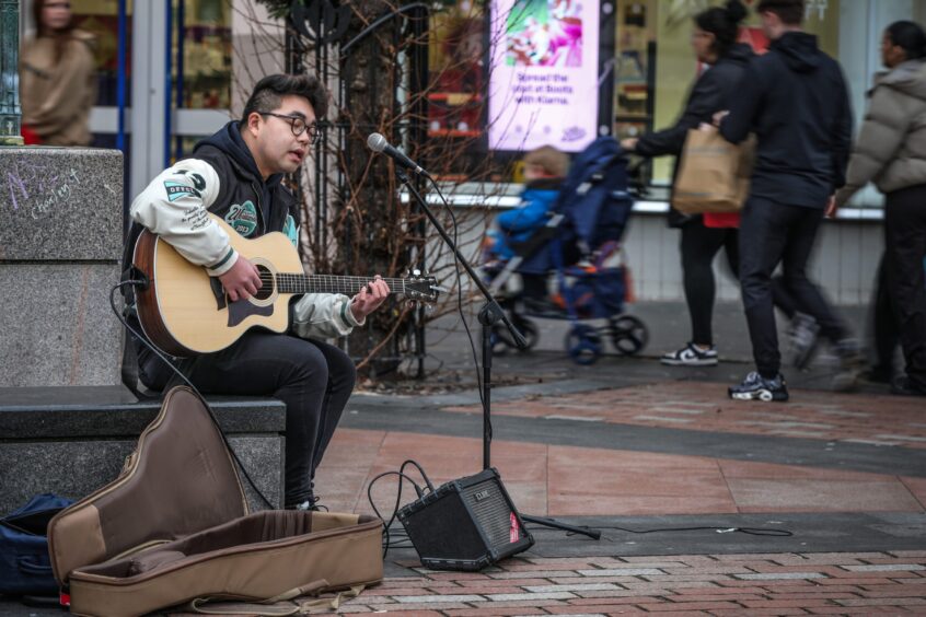 Dundee busker Spencer Shek says busking is his main source of income. 