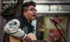 Spencer Shek singing outside the Overgate Shopping Centre.