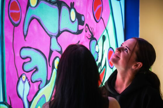 People looking at colourful display in Perth Museum