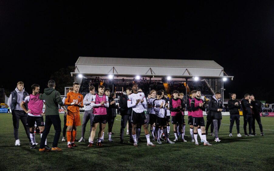 Dejected Dundalk players applaud their fans after succumbing to the drop