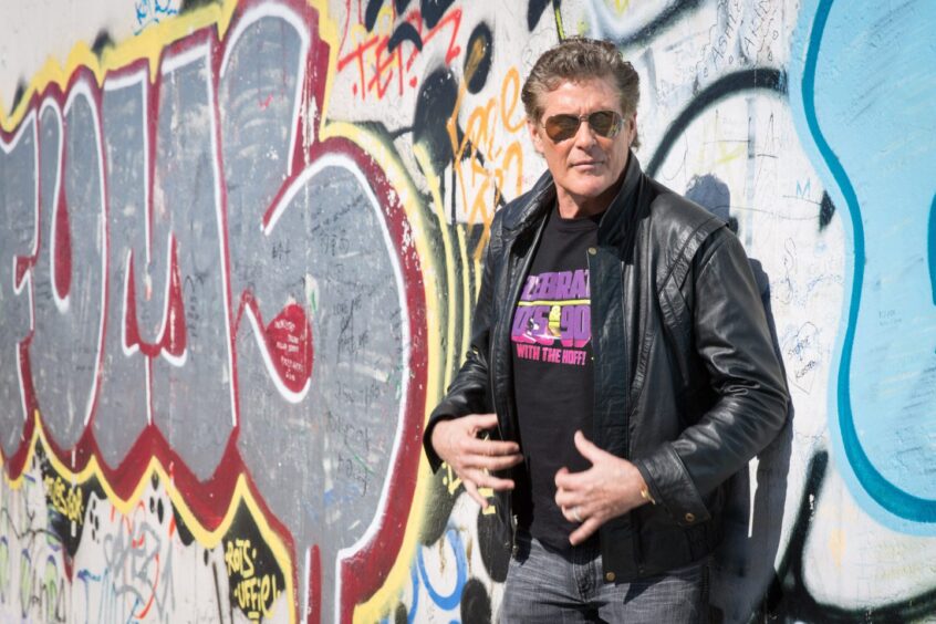 David Hasselhoff returned to the Berlin Wall in 2014, leaning against a section of it covered with graffiti