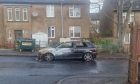 The burnt-out car on St Columba Gardens. Image: Supplied