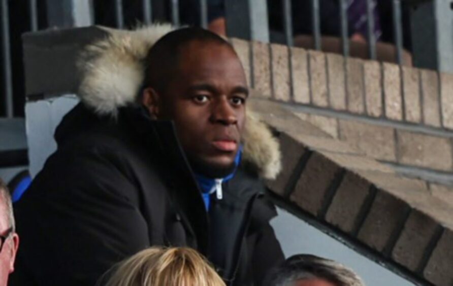 Uche Ikpeazu watching St Johnstone from the main stand at McDiarmid Park.