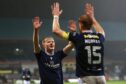 Lyall Cameron thanks skipper Simon Murray after making it 4-1 to Dundee against Motherwell. Image: David Young/Shutterstock