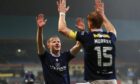 Lyall Cameron thanks skipper Simon Murray after making it 4-1 to Dundee against Motherwell. Image: David Young/Shutterstock