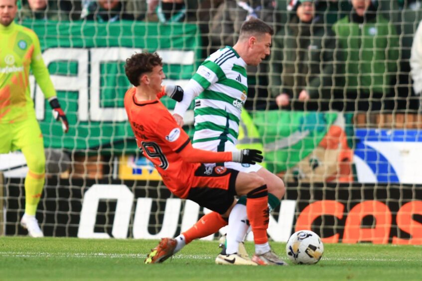 Dundee United's Miller Thomson challenges Celtic captain Callum McGregor