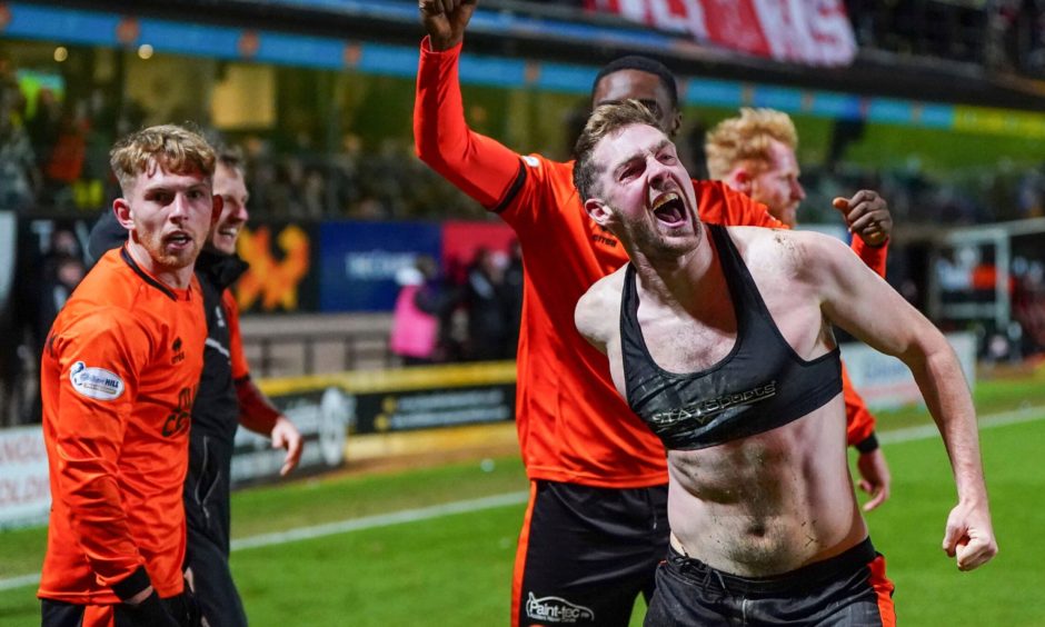 Kevin Holt roars with delight as Dundee United claim victory over Aberdeen.