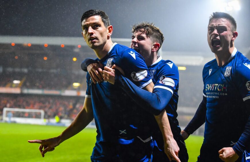Graham Dorrans celebrates his derby goal for Dundee
