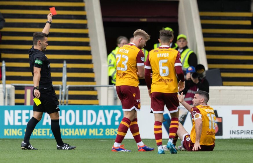 Referee Nick Walsh has already flashed one red card at Fir Park this season