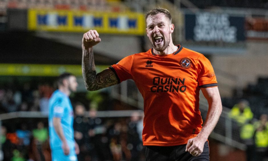 Dundee United's Kevin Holt roars with delight