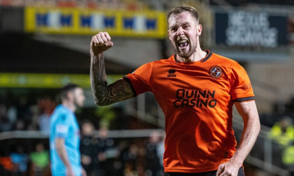 Dundee United's Kevin Holt roars with delight