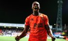 Dundee United defender Emmanuel Adegboyega roars with delight