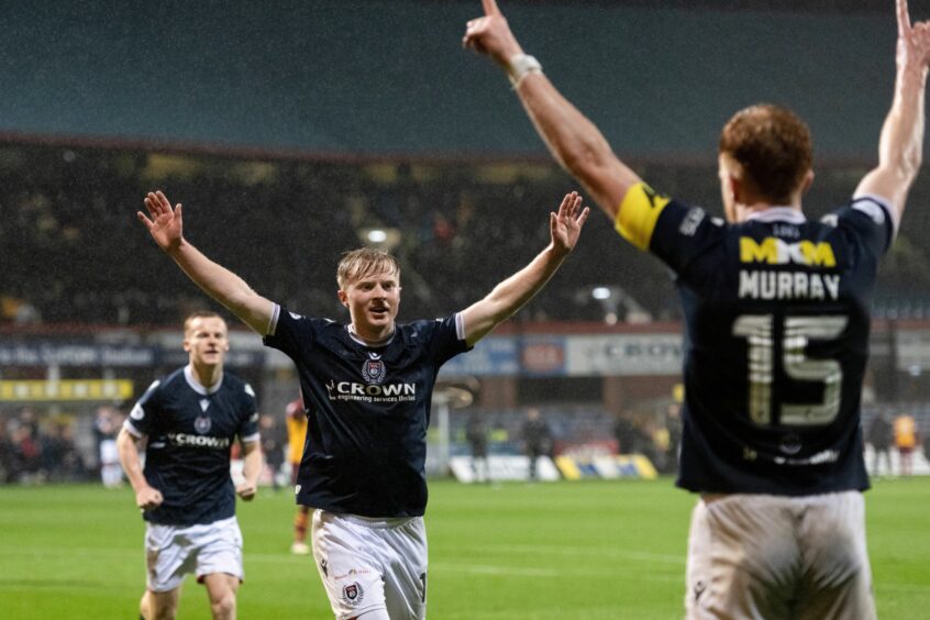 Hands high as Dee celebrate against Motherwell. Image: Paul Devlin/SNS