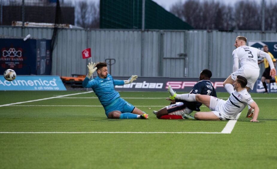 Winger Alfie Agyeman slides in to score for Falkirk.