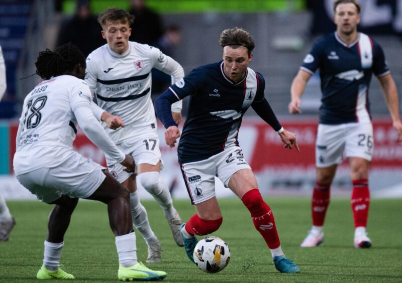 Raith Rovers and Falkirk players battle for possession.