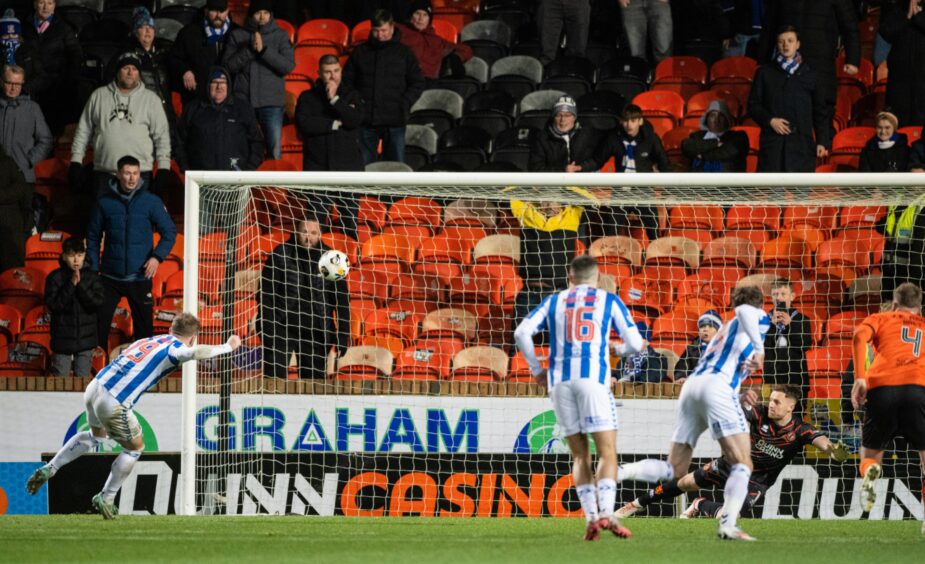 Bruce Anderson slams home the spot-kick