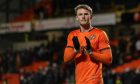 Sam Dalby applauds the Dundee United fans at full-time