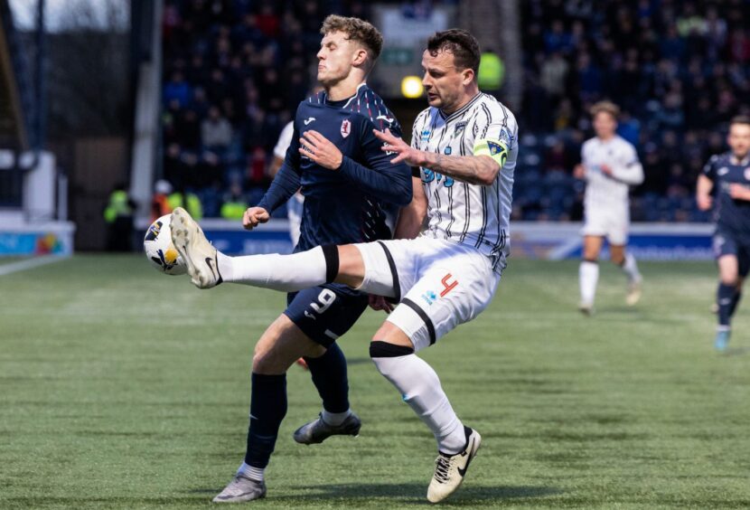 Jack Hamilton challenges Dunfermline defender Kyle Benedictus during December's Fife derby.