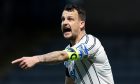 Dunfermline Athletic FC skipper Kyle Benedictus points and shouts.