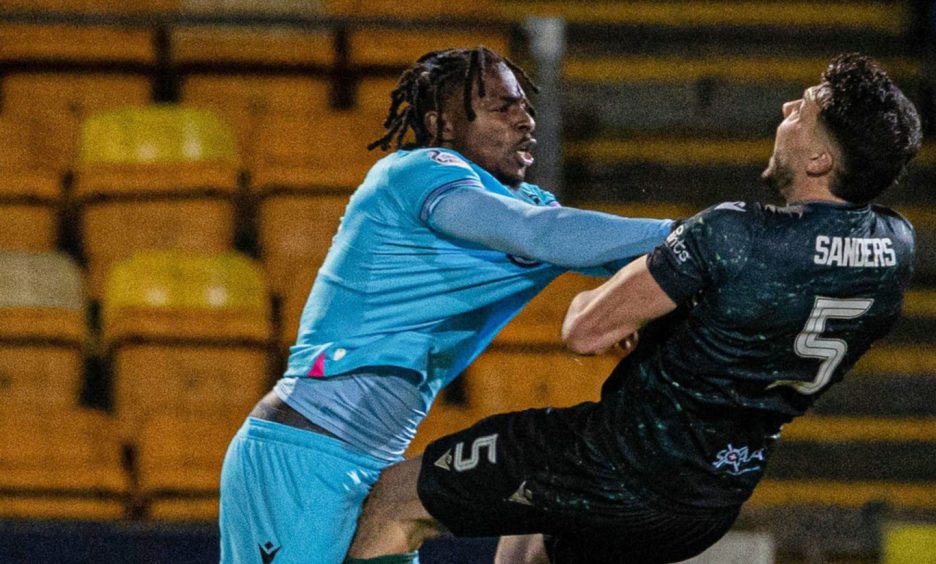 St Mirren's Toyosi Olusanya pushes St Johnstone's Jack Sanders.