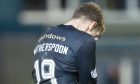 DAFC midfielder David Wotherspoon buries his head in his hands.
