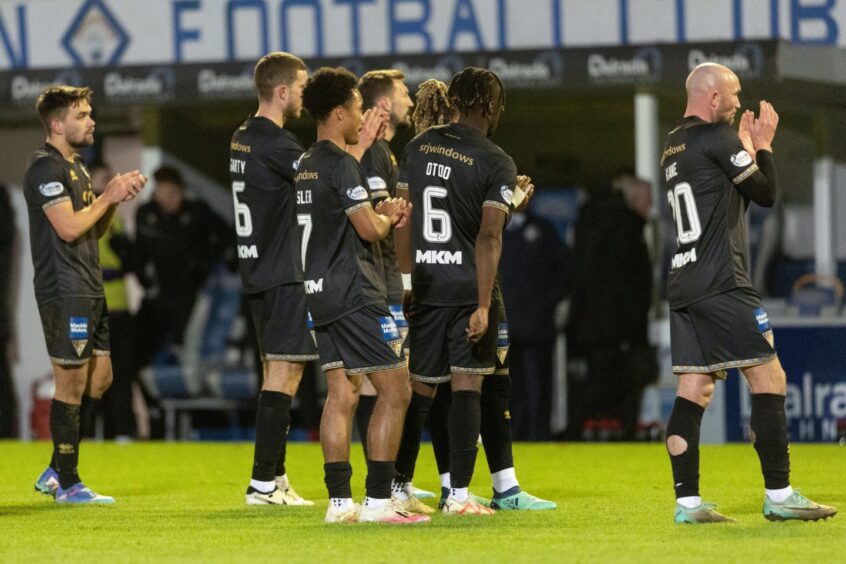 The Dunfermline players clap to show their appreciation of the supporters who travelled to Cappielow.