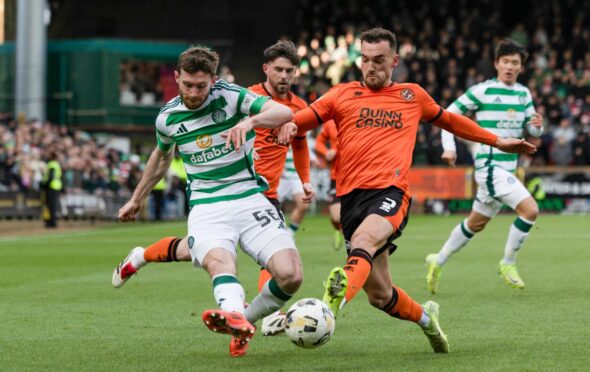Dundee United's Vicko Sevelj and Celtic's Anthony Ralston tussle during the meeting of their sides at Tannadice in December. Image: SNS