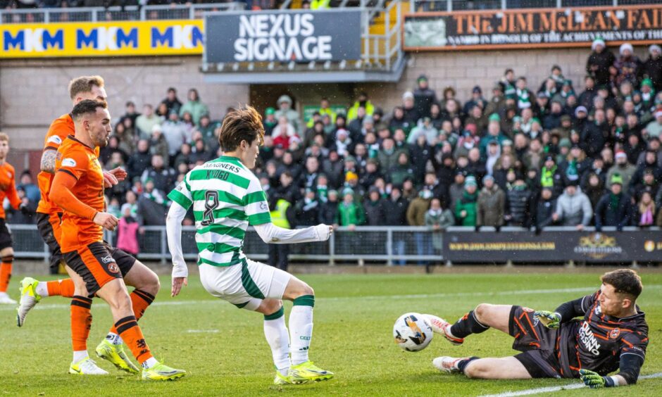 Dundee United's Jack Walton smothers a Kyogo effort
