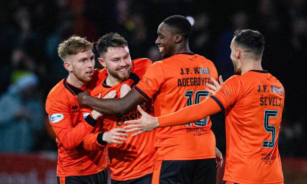 Dundee United players celebrate Middleton's equaliser