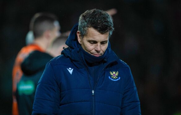 St Johnstone head coach Simo Valakari looks dejected after his team lost to Dundee United.
