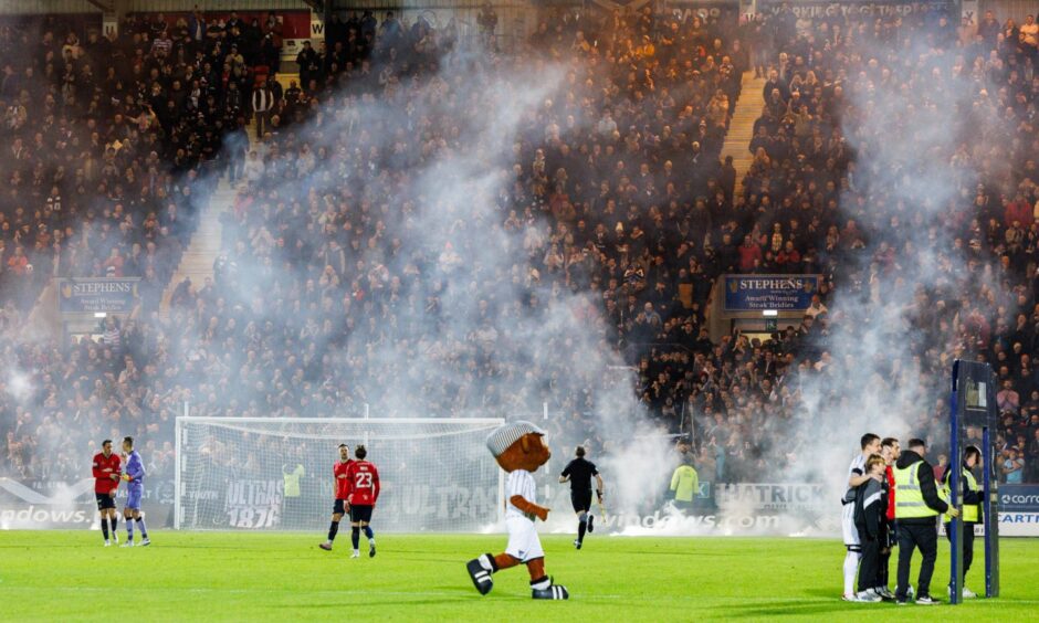 Smoke billows round East End Park before a Dunfermline V Falkirk match.