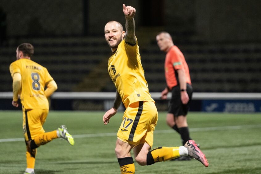 Stevie May gives the thumbs up to the Livingston crowd after netting his penalty.