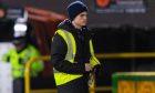 A steward removes the vodka bottle from the pitch