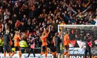 Dundee United players take the acclaim of the fans at Tannadice