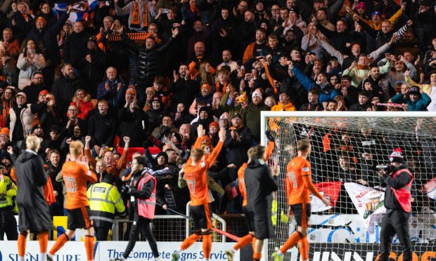 Dundee United players take the acclaim of the fans at Tannadice