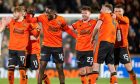 Ross Docherty celebrates with his teammates after helping to down Aberdeen