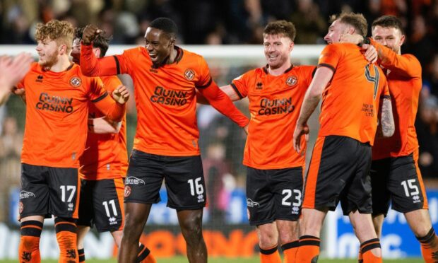 Ross Docherty celebrates with his teammates after helping to down Aberdeen