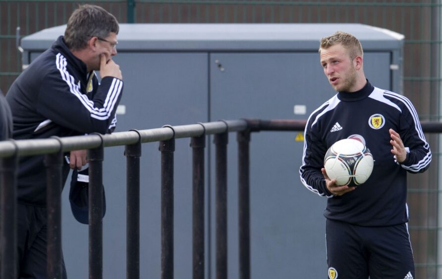 Tough love: Craig Levein, left, and Johnny Russell