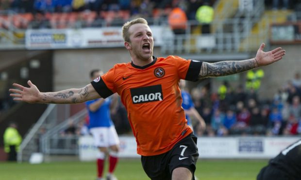 Johnny Russell celebrates a Dundee United goal against Rangers.