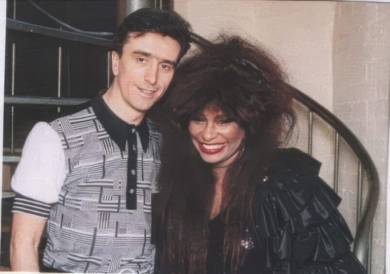 Tony Cochrane and a smiling Chaka Khan at De Stihl's in December 1989.