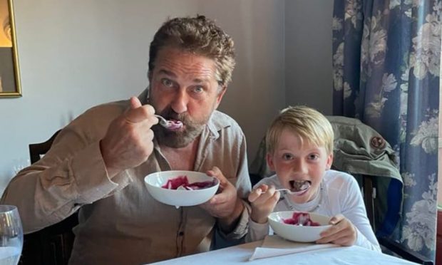 Crieff youngster Leatham Bilsland with Gerard Butler