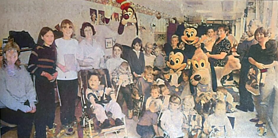 Mickey and the gang with children at Ninewells Hospital. 