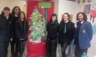 Grove Academy pupils with their famous Merry Bratmas door. Image: Grove Academy