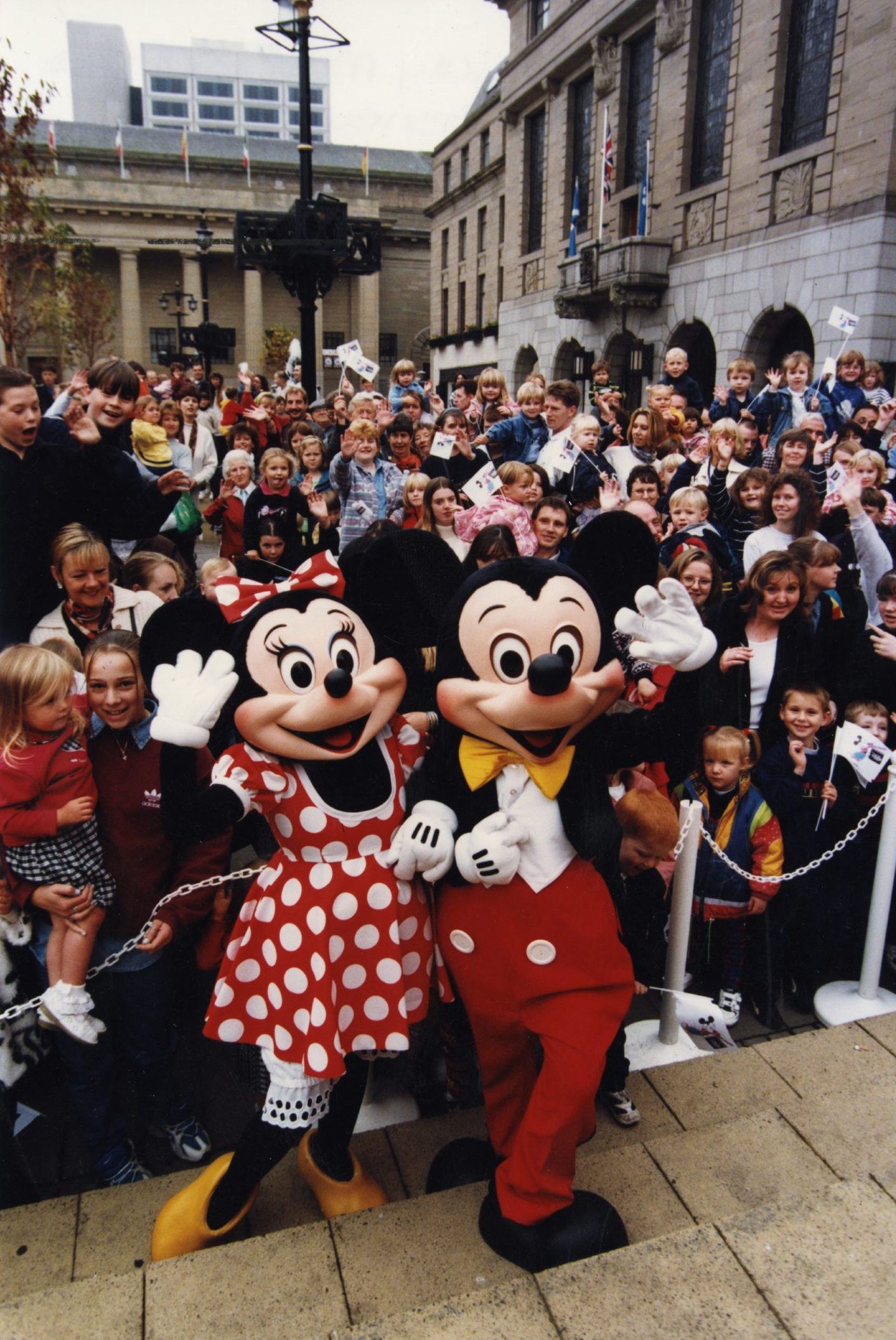 Shoppers beside Mickey and Minnie in Dundee City Square on the opening day of the Disney store 