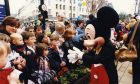 Mickey Mouse greets shoppers outside the store in City Square in 1997.