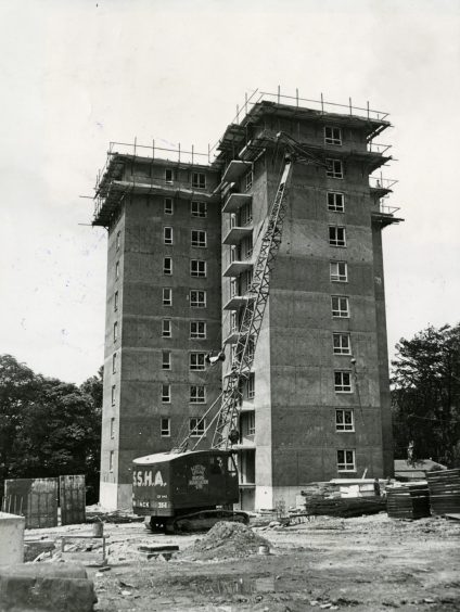 A crane beside the first multi-storey flat under construction in Dryburgh in 1959.