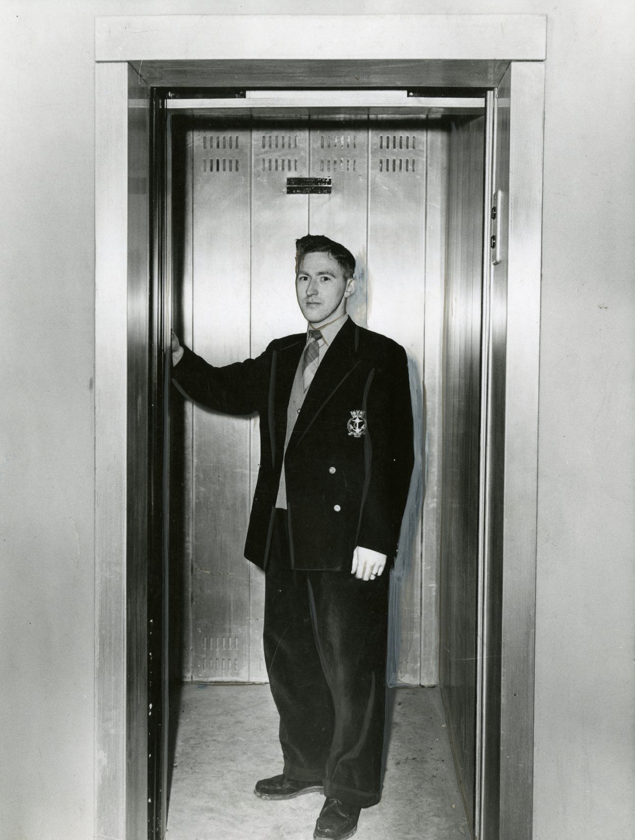 The caretaker in the lift at the Dryburgh multi flats in February 1960. 