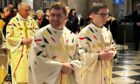 Priests taking part in a celebratory mass at Notre Dame last week, wearing robes using Perthshire-made wool. Image: Macnaughton Holdings.